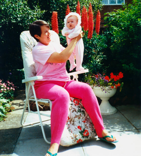 photo scan mother holds baby in garden