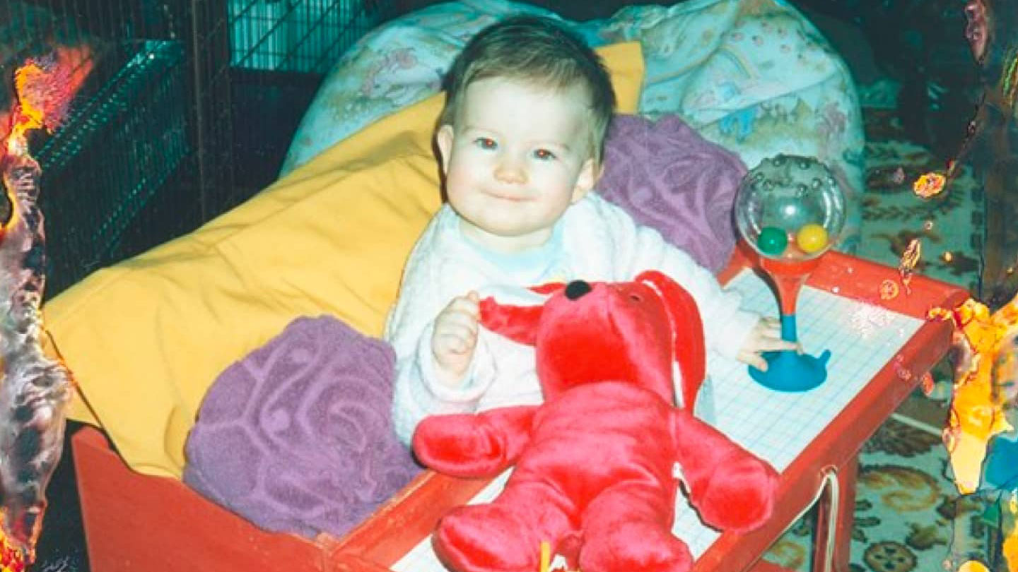 damaged photograph of toddler in living room